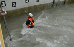 Person in harness, up to hip in water